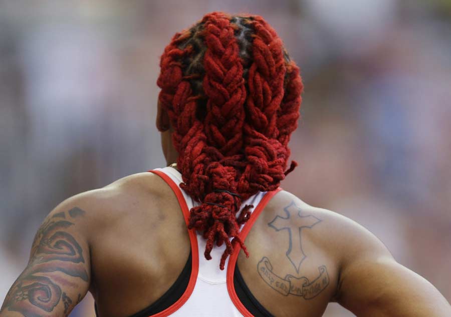 Lee Michelle Ahye de Trinidad y Tobago durante la carrera femenina de 100 metros en el Mundial de Atletismo de Pekín, 23 de agosto de2015. 