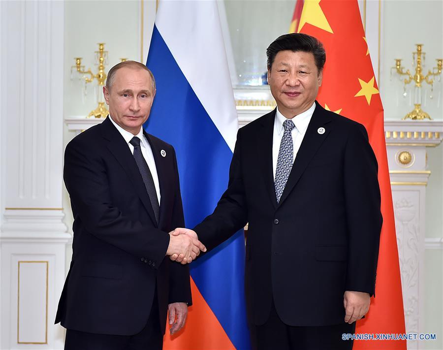 El presidente de China, Xi Jinping (d), se reúne con el presidente de Rusia, Vladimir Putin, en Taskent, Uzbekistán, el 23 de junio de 2016. (Xinhua/Li Tao)