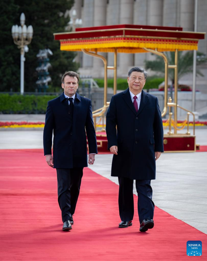 Xi sostiene conversaciones con presidente francés