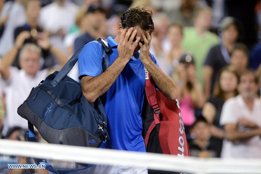 Robredo eliminó a Federer y pasó a cuartos de final