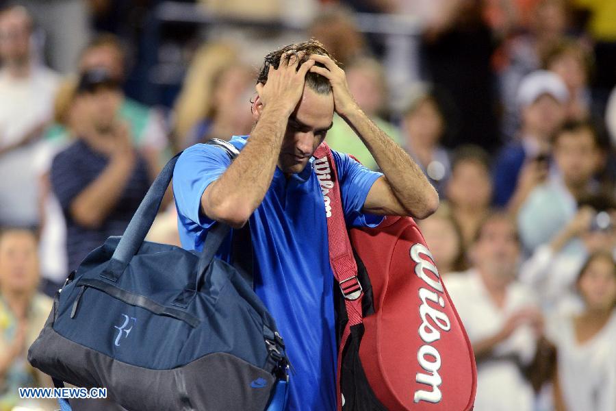 Robredo eliminó a Federer y pasó a cuartos de final